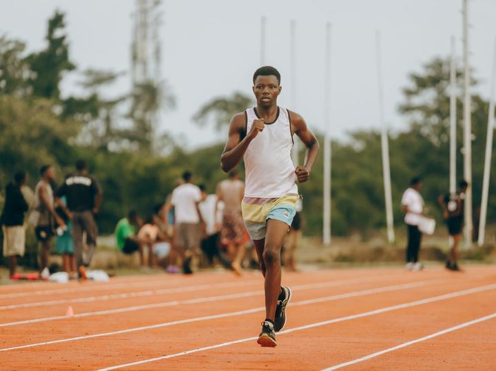 A runner training on a track in Lagos